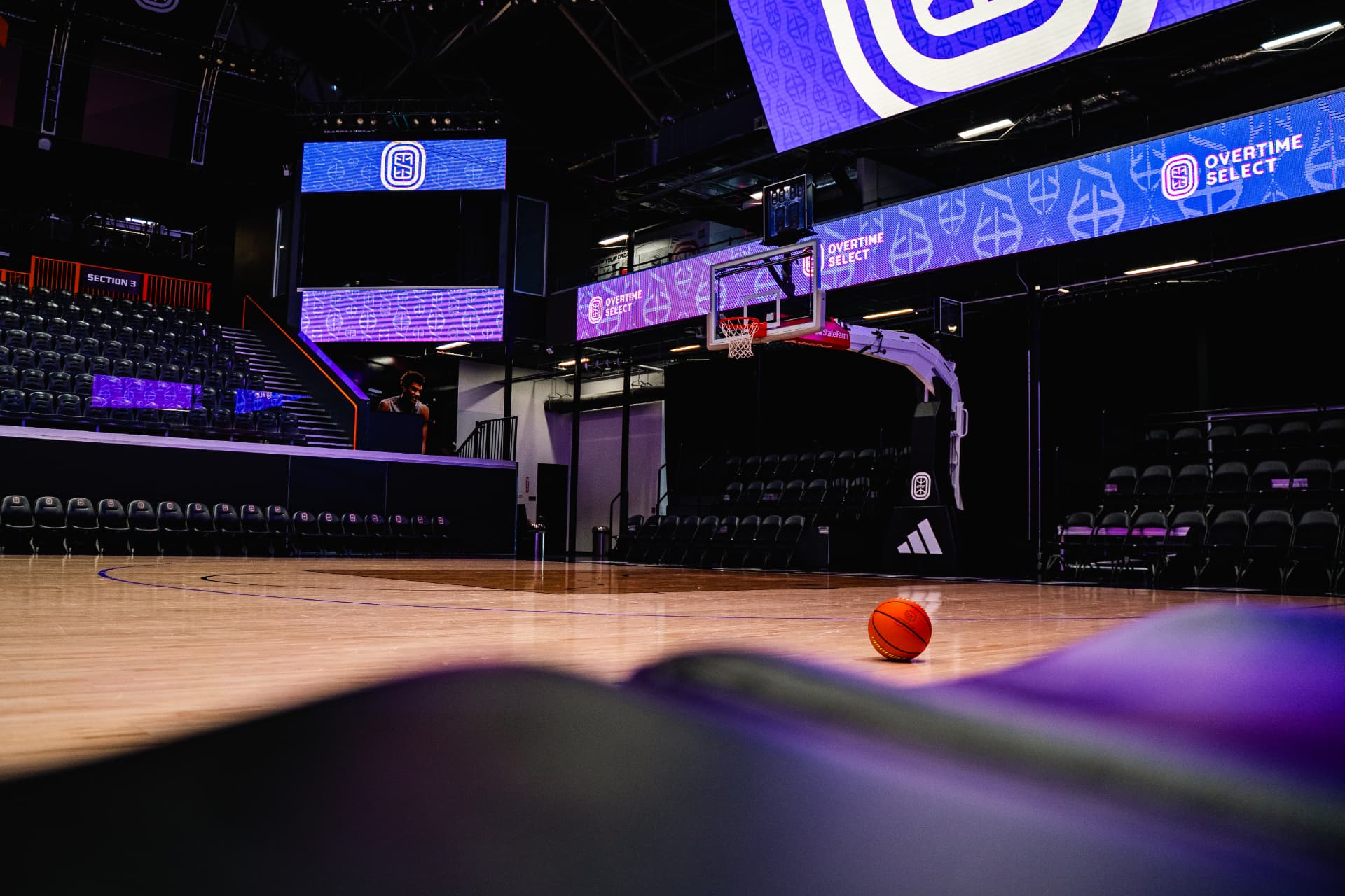 Arena court with a basketball at center
